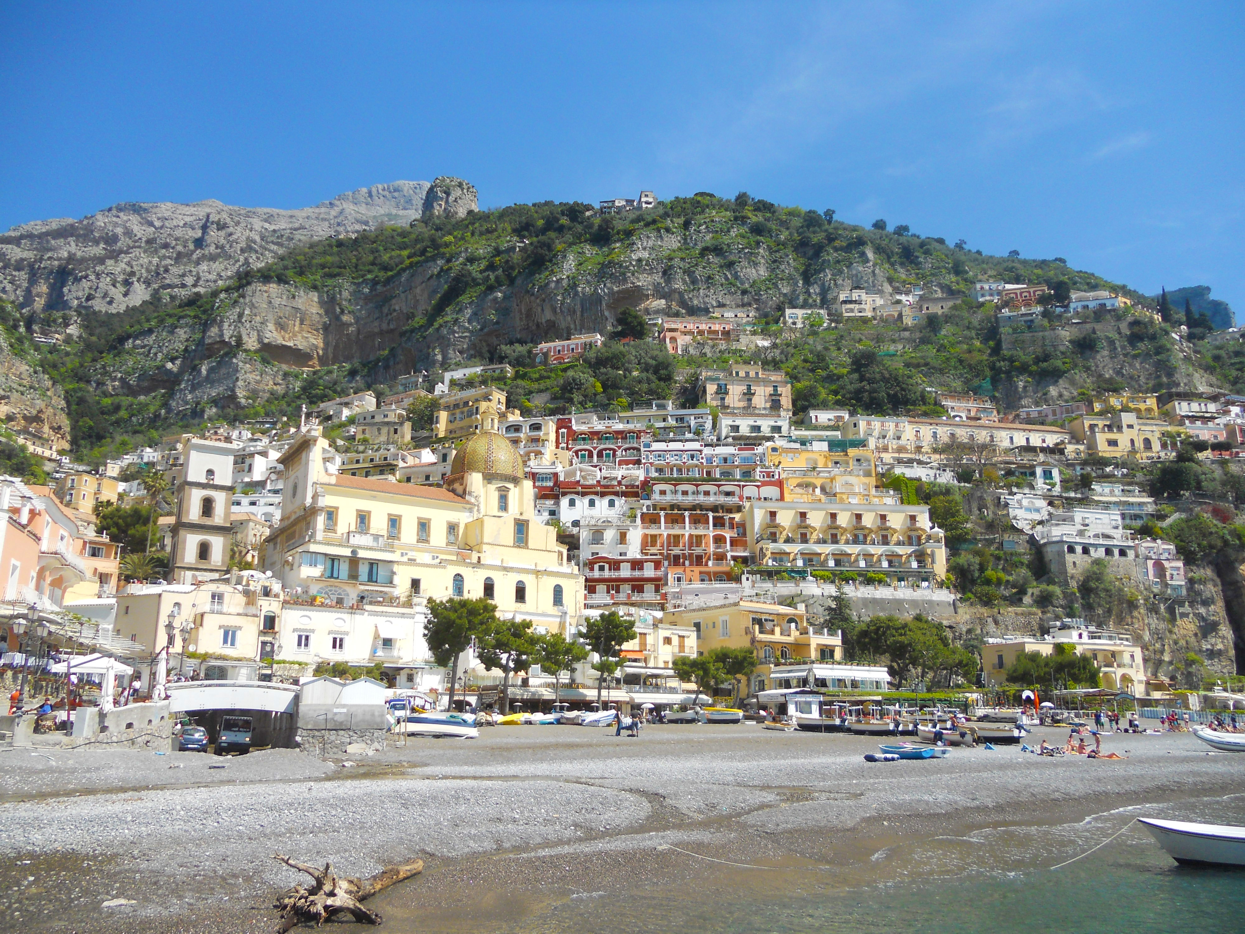 Colorful houses and hotels of Positano climbing the steep hillside above the Mediterranean