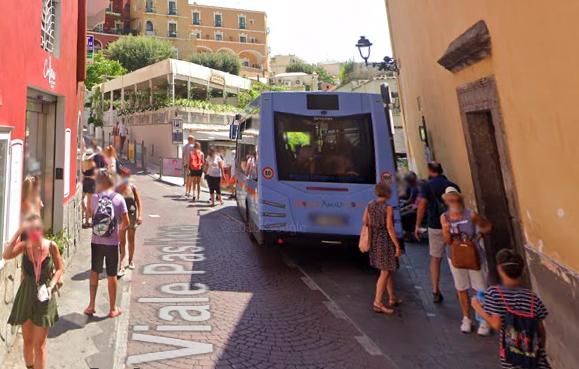 Piazza dei Mulini bus stop in Positano's town center shopping district.