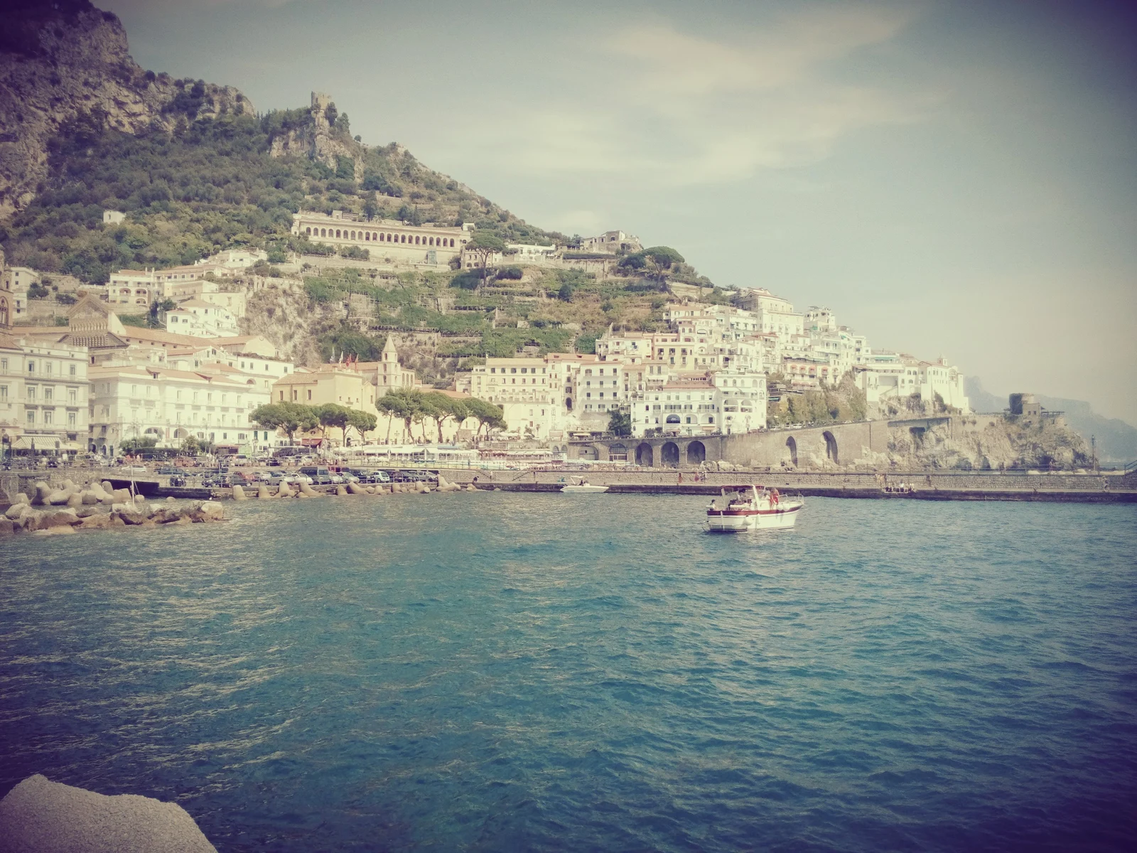 Amalfi waterfront and harbor area with boats, seen from near the ferry dock