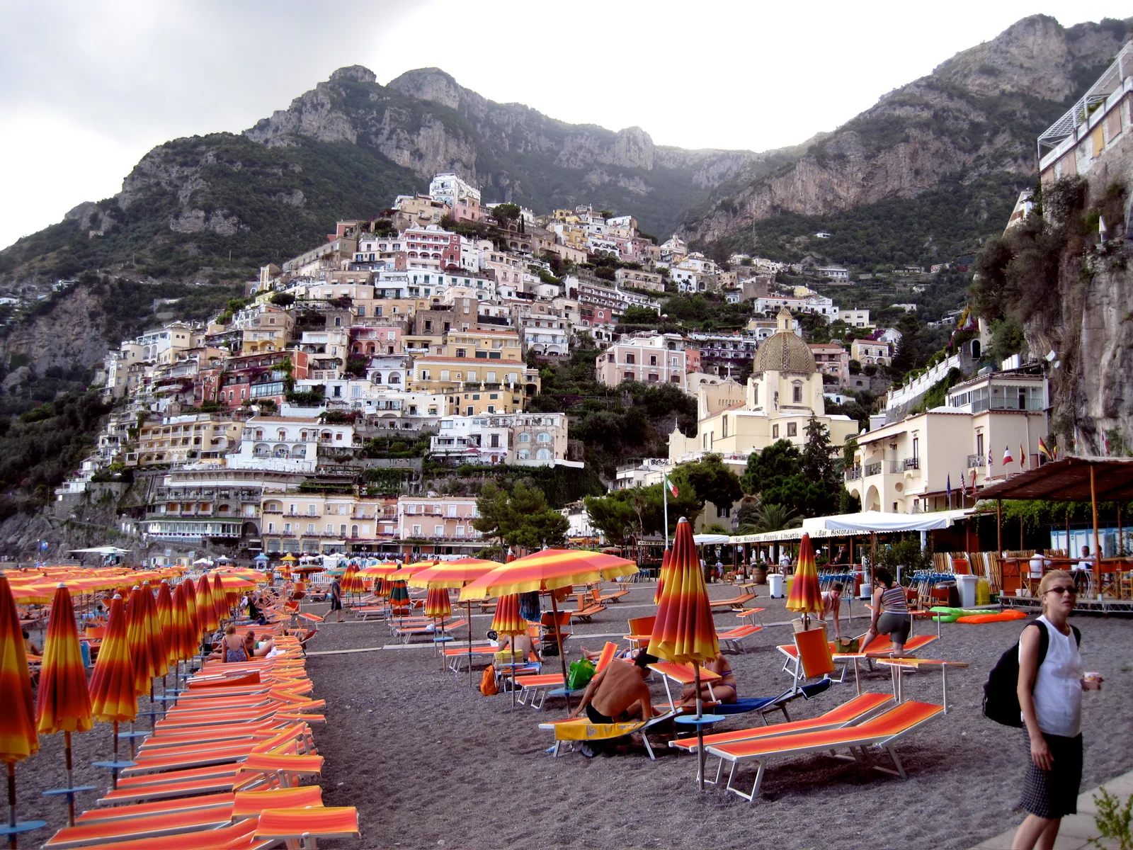 Panoramic view of Positano’s umbrellas and the town climbing the cliffs