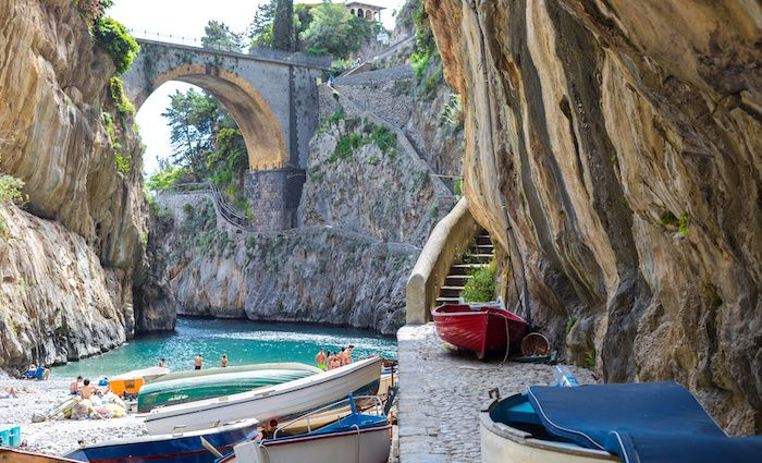 View into the Fiordo di Furore cove with the bridge above and the narrow beach below