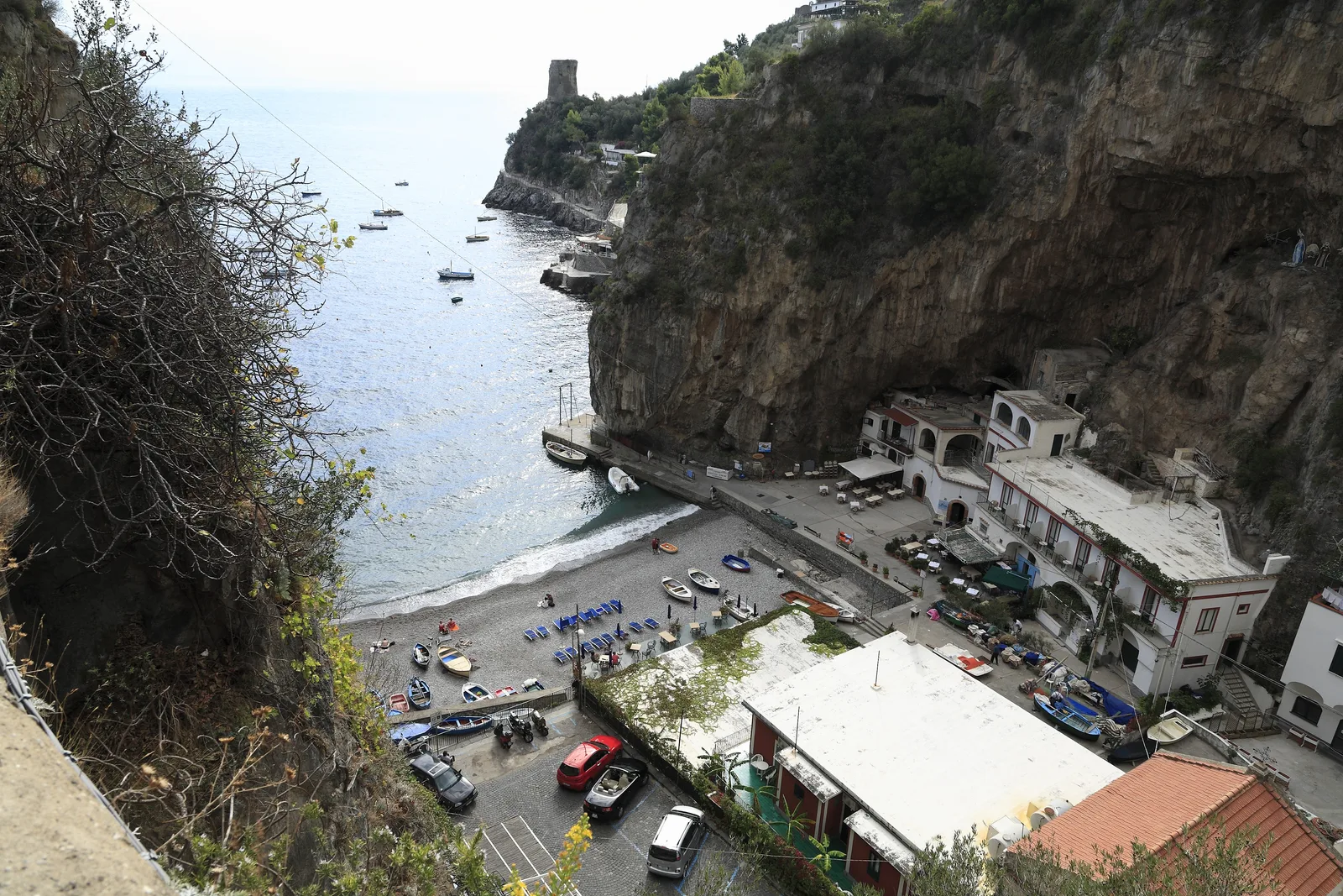 Marina di Praia cove framed by cliffs and boats