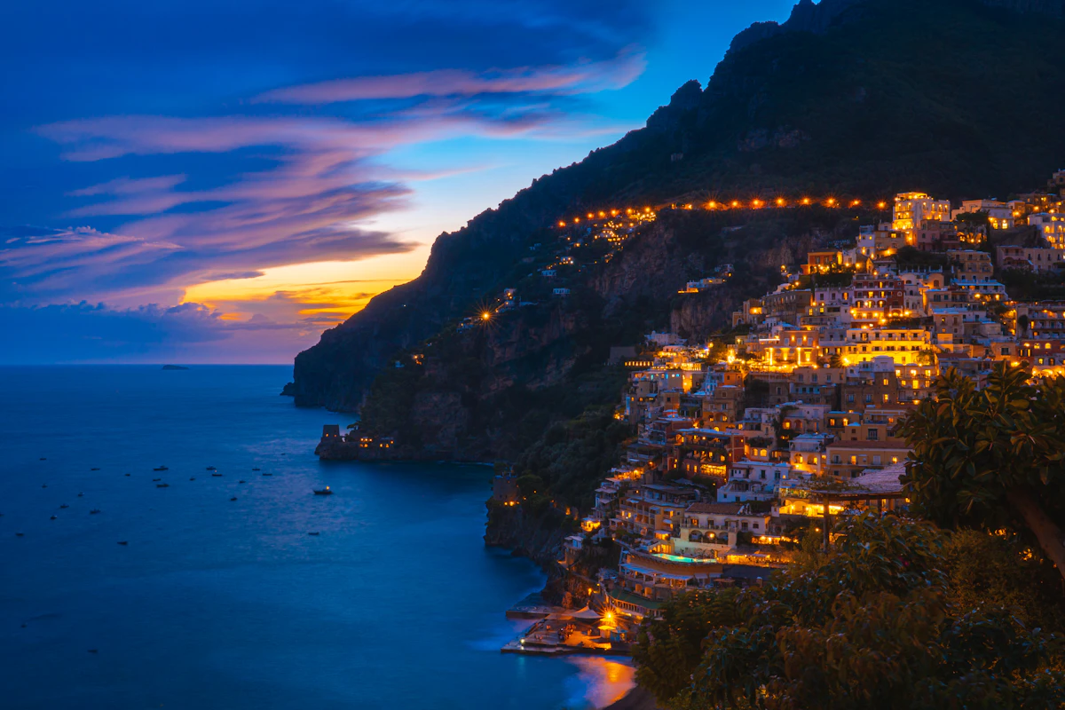 View of Positano from the water with the town rising up the cliff