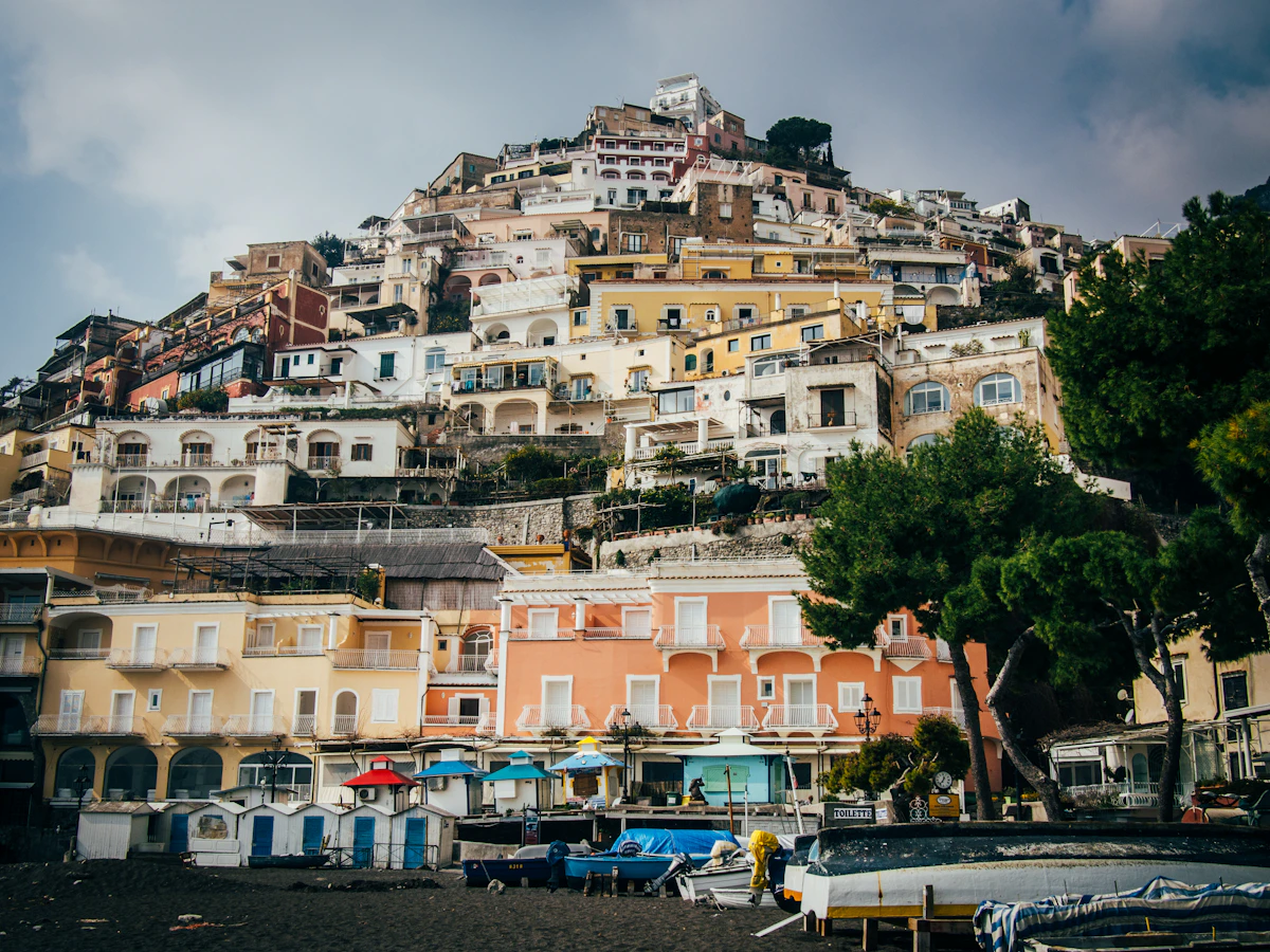 View of Positano from the beach with the town cascading up the cliff