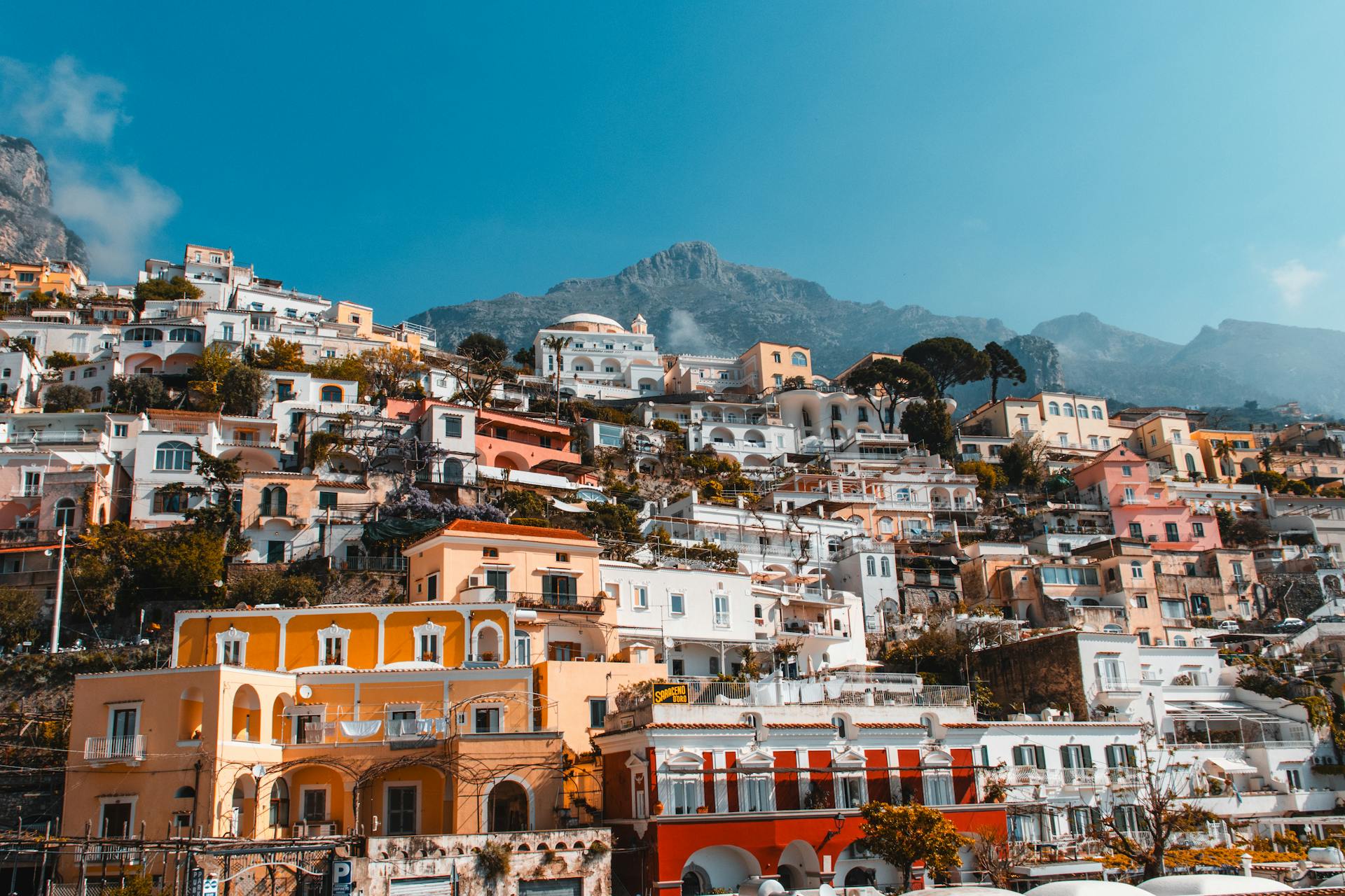 Positano beach with colorful umbrellas along the coastline